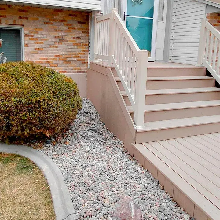 New grey composite deck and entry stairs installation by DeckPro LLC in Rexburg, ID.