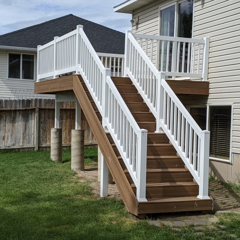 We are proud to present "Apex Elevated Access," a stunning example of our custom, low-maintenance raised composite deck and backyard stairs installation. This comprehensive project showcases DeckPro LLC's expertise in creating safe, beautiful, and durable elevated outdoor spaces. Crafted with premium, rich brown wood-grain textured low-maintenance composite decking boards, this raised platform provides an inviting retreat attached to the home's upper level.