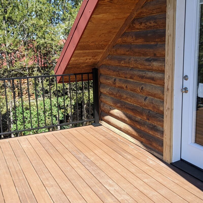 Expand your outdoor living possibilities with this custom composite deck by DeckPro LLC. This design provides a safe and stylish transition from your home to your backyard, even in snowy conditions, thanks to durable, low-maintenance composite materials. We included a unique railing system that combines clean white posts with a striking horizontal louvered privacy wall on one end, creating a cozy and inviting retreat.