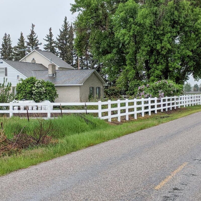 Expand your outdoor living possibilities with this extensive multi-level deck project by DeckPro LLC. We installed high-quality, low-maintenance composite decking in a warm wood-grain tone and paired it with a unique curved metal perimeter railing for a sophisticated look. This custom raised structure transitions seamlessly from the home's unique stucco and brick architecture, with a massive and inviting set of stairs leading to a lower concrete patio level. Bordered by a stunning natural boulder retaining wall, this sturdy retreat offers defined sun and shade areas perfect for relaxation or entertaining.