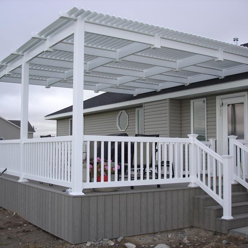 Transform your outdoor space into a versatile and comfortable haven with our ApexLouver attached pergola. This stunning project features a durable, white vinyl attached pergola designed to seamlessly extend from your home, providing adjustable shade control with its integrated louvered roofing system. Perfect for sun or shade on demand. The pergola rests on a premium gray composite deck with matching white railings and stairs, offering a low-maintenance, stylish solution for relaxation and entertainment. Contact us to learn how an attached louvered pergola can enhance your property value and lifestyle.