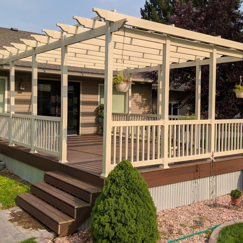 Enhance your backyard's comfort and style with a custom-built tan vinyl pergola and composite deck from DeckPro LLC. This low-maintenance outdoor living space is perfect for relaxing in the shade and entertaining guests, complete with matching railings and durable materials that stand the test of time.Add a touch of nature directly to your deck design with a custom built-in planter from DeckPro LLC. This project features low-maintenance grey composite decking and an integrated planter box, ready for your favorite flowers or herbs.